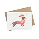 Eco-friendly greeting card with dachshund dressed in Christmas outfit