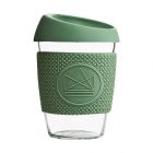 Reusable glass coffee cup with green silicone textured anti-slip grip sleeve and splash proof lid.