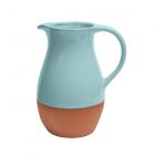 a light blue glazed terracotta jug for serving drinks
