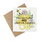 a plantable seeded wedding card with a floral bee design