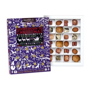 An image of an advent calendar with the various treats inside on display