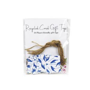 Folded gift tags made from recycled paper, featuring a happy birthday whales print.