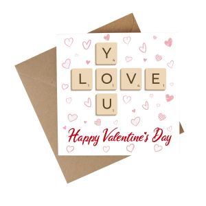a romantic valentines day card with a scrabble themed hearts design, made from eco friendly recycled paper